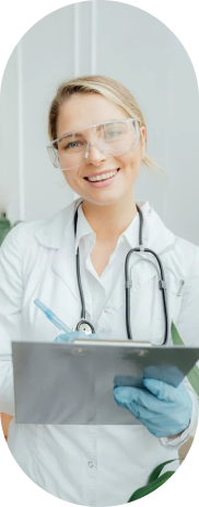 A doctor holding a clipboard and smiling